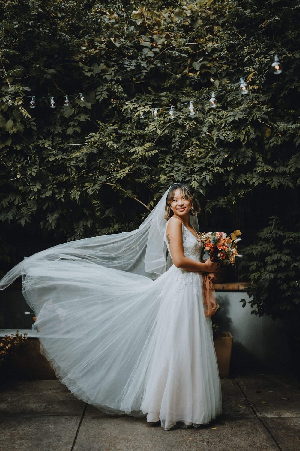 Naomi under the string lights.jpeg