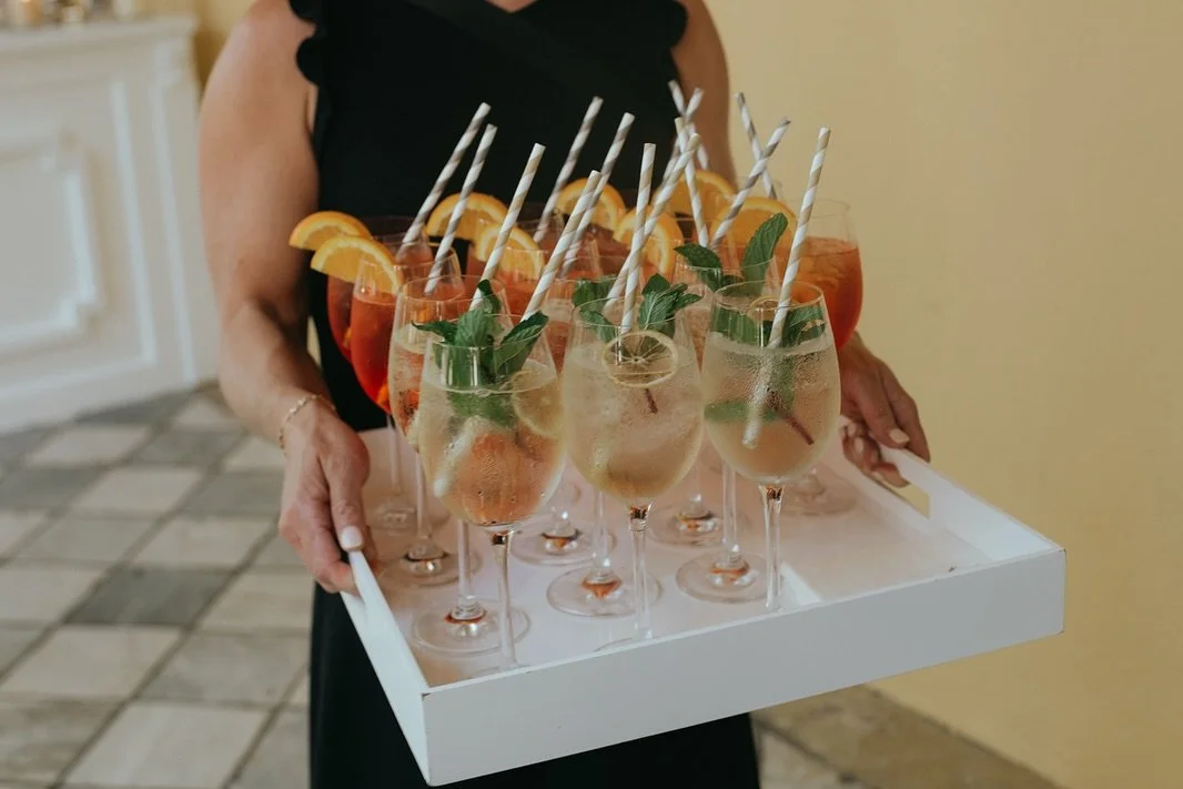 A touch of Italy right here in Charleston 🍊

Anna &amp; Josh had a clear vision for how they wanted their day to look and feel, and it was an honor to bring it to life!

Spritzes in hand, long wooden dining tables, gelato and cannoli for dessert, an
