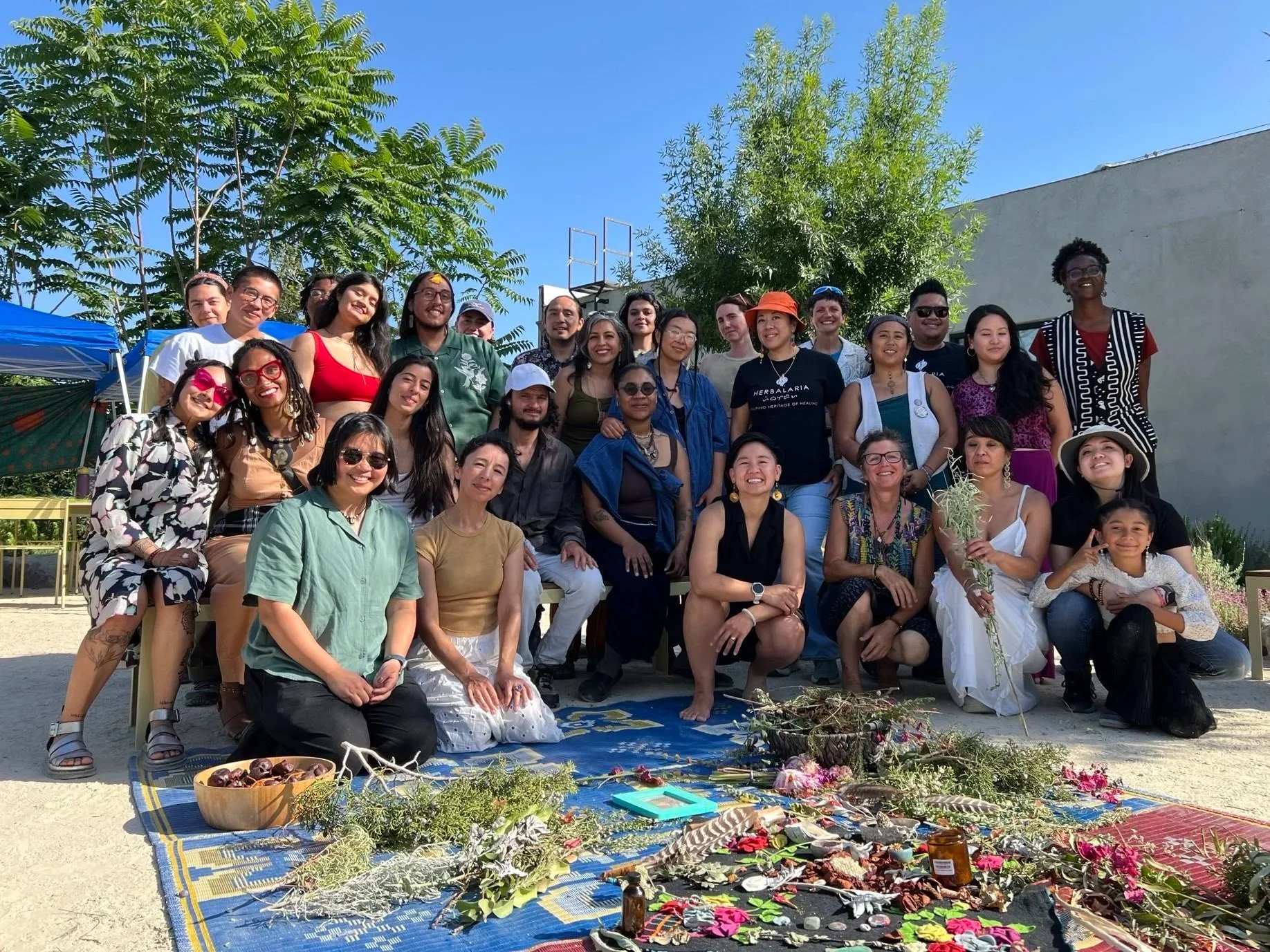 j. nyla sits in the middle of a panel with their colleagues from various organizations, including the City of Long Beach's Office of Youth Development, for a lived expertise panel on navigating mental health services and issues as youth.