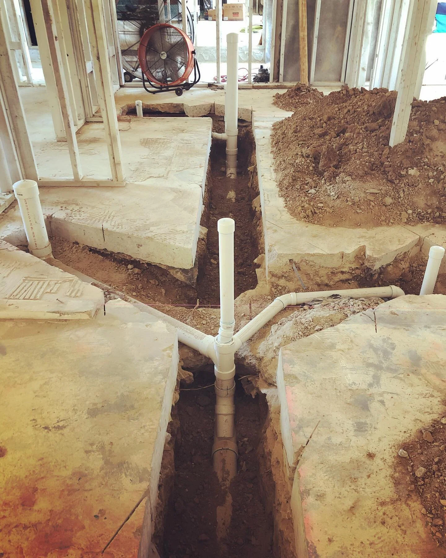 Not installation art nor archeological dig just replacing a 60 year old sewer line under a 6&rdquo; slab.