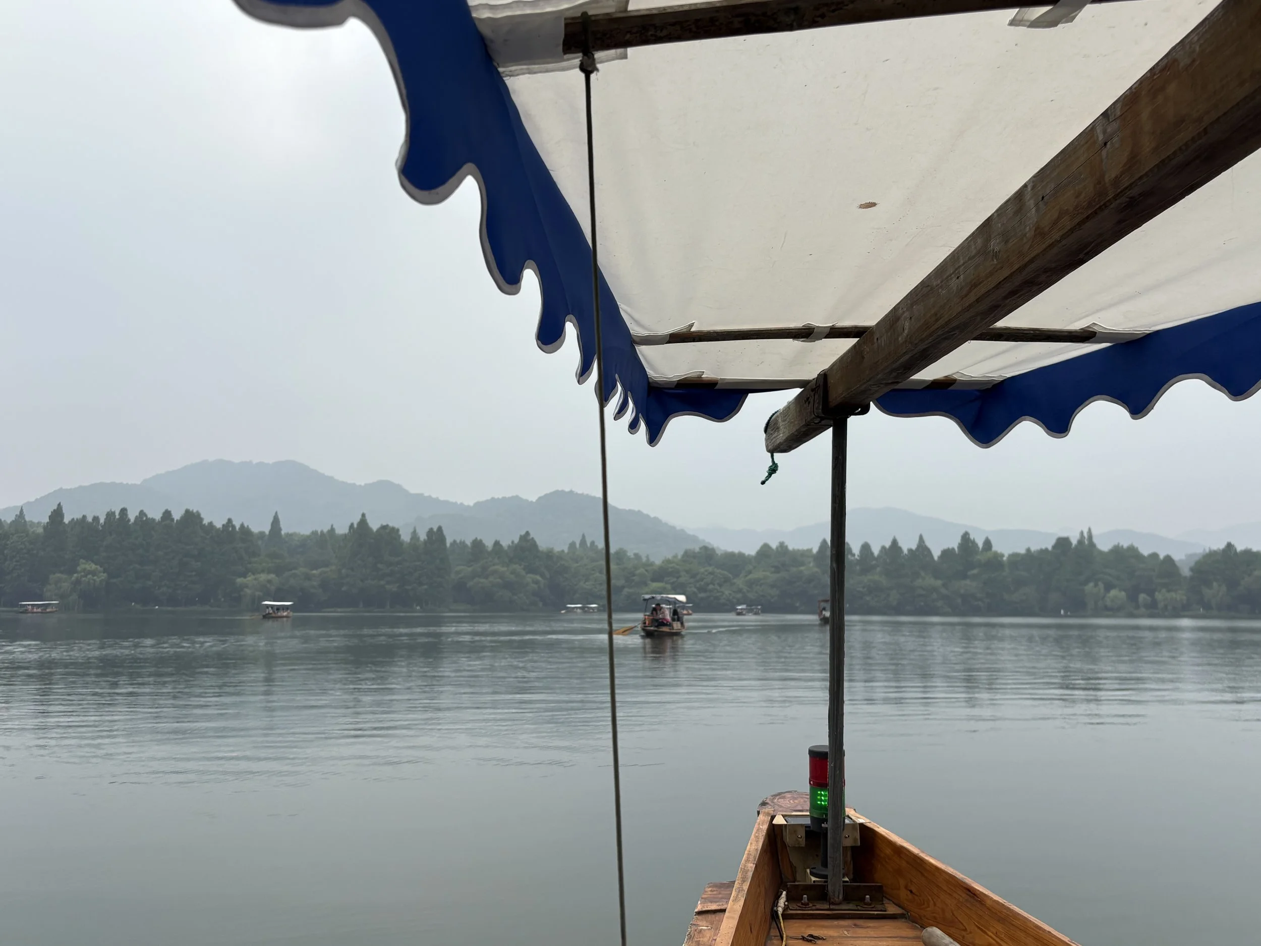 West Lake Hangzhou: A Guide to the Traditional Hand-Rowed Boat Ride