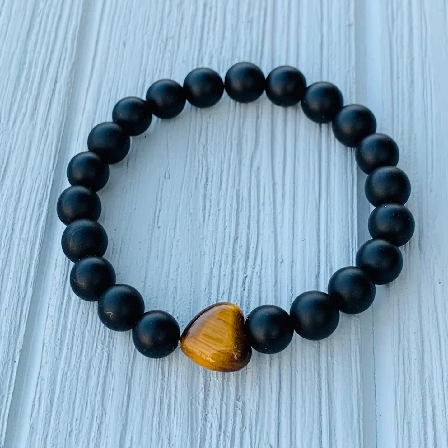 28. Matte black onyx w/Tiger Eye heart | $20.00