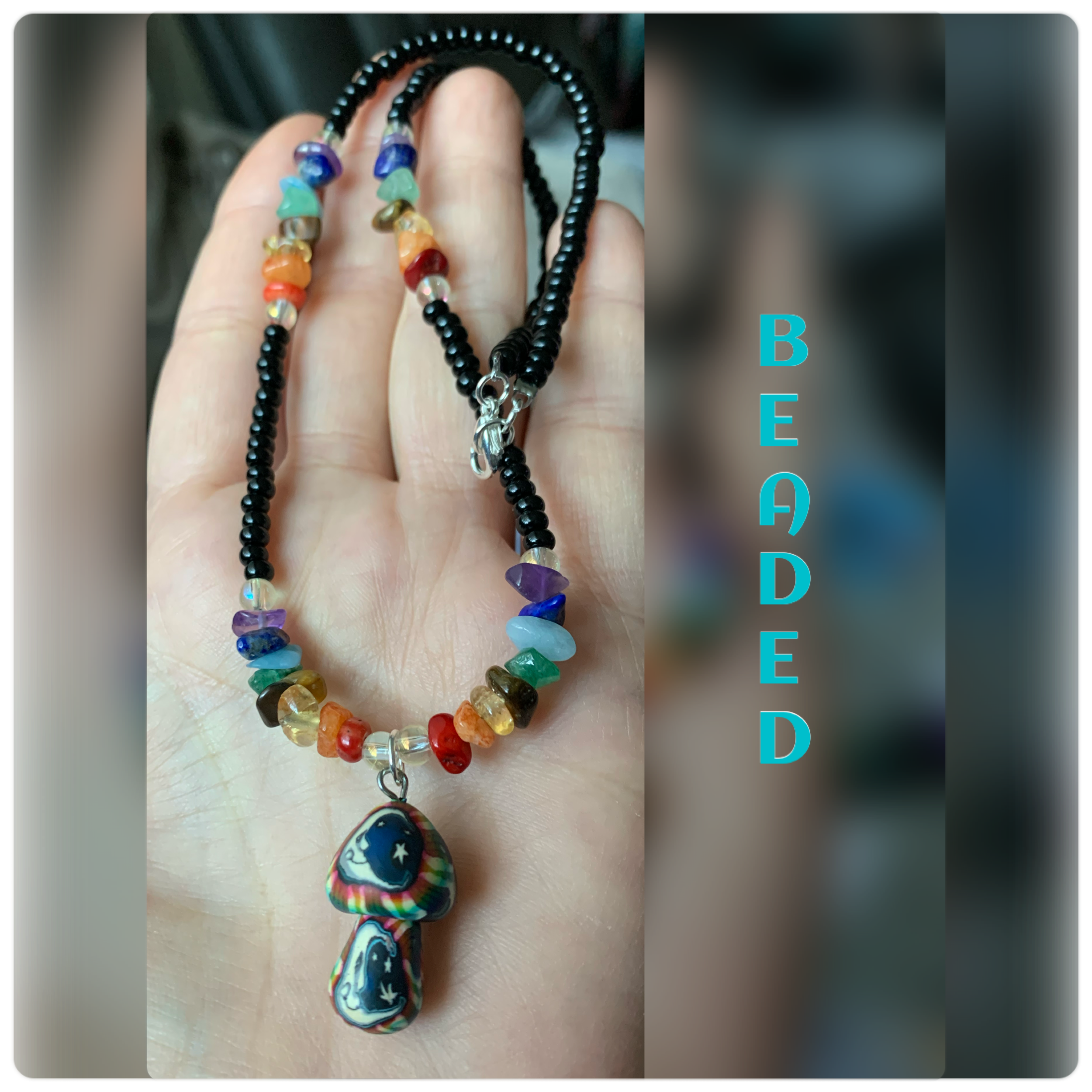 11. Black glass & opalescent beads, gemstone chips and rainbow mushroom/moon pendant