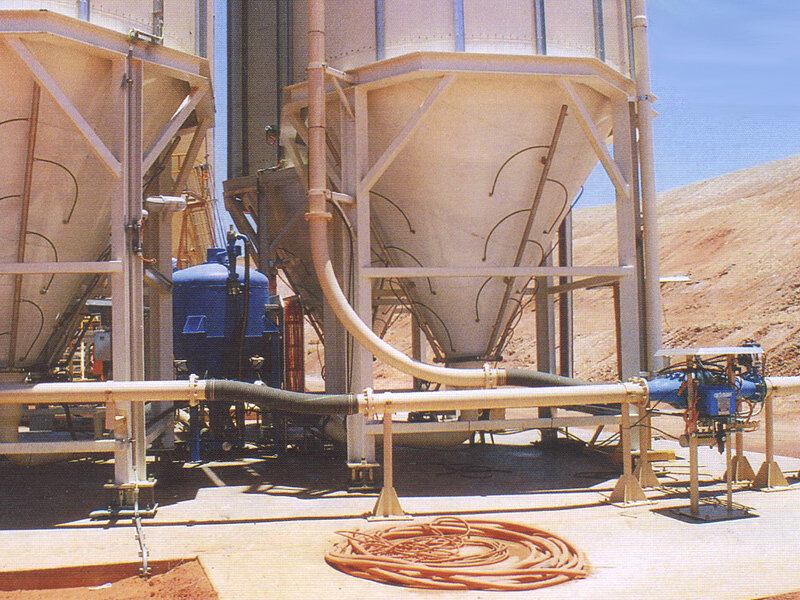 The HC-75 conveyor is clearly seen. The truck delivery inlet is on the RHS along with two of the Cyclonaire heavy duty pinch type valves chosen for their robustness. Alongside is the shielded valve controller. Also noticeable is the aeration set up.