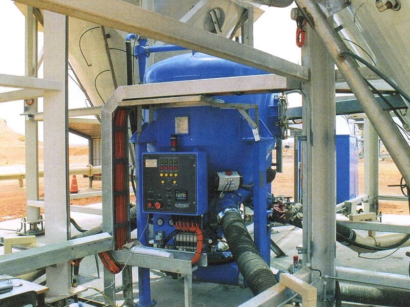 Four flexible hose inlets (three clearly seen) leading to the HC-75 Cyclonaire c/w shielded PLC controller. The conveyor discharge line is at the bottom RH corner.