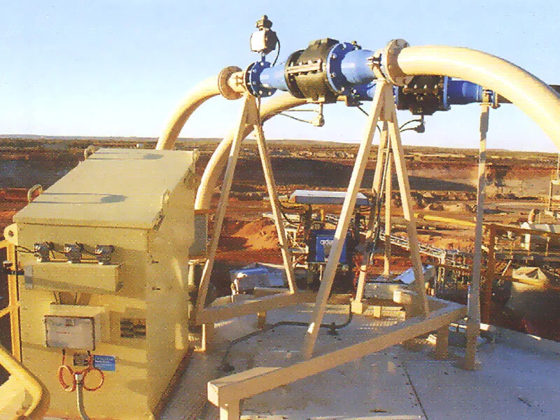 View from top of 4 x125t silo top decks showing dust collector at left, pinch type diverter valves, controller, prefabricated pipe work and supports.