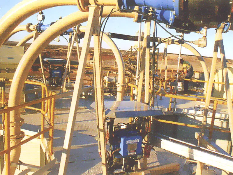 Silo roof view again - busy scene showing pipe work, Cyclonaire pinch type valves and shielded controllers.