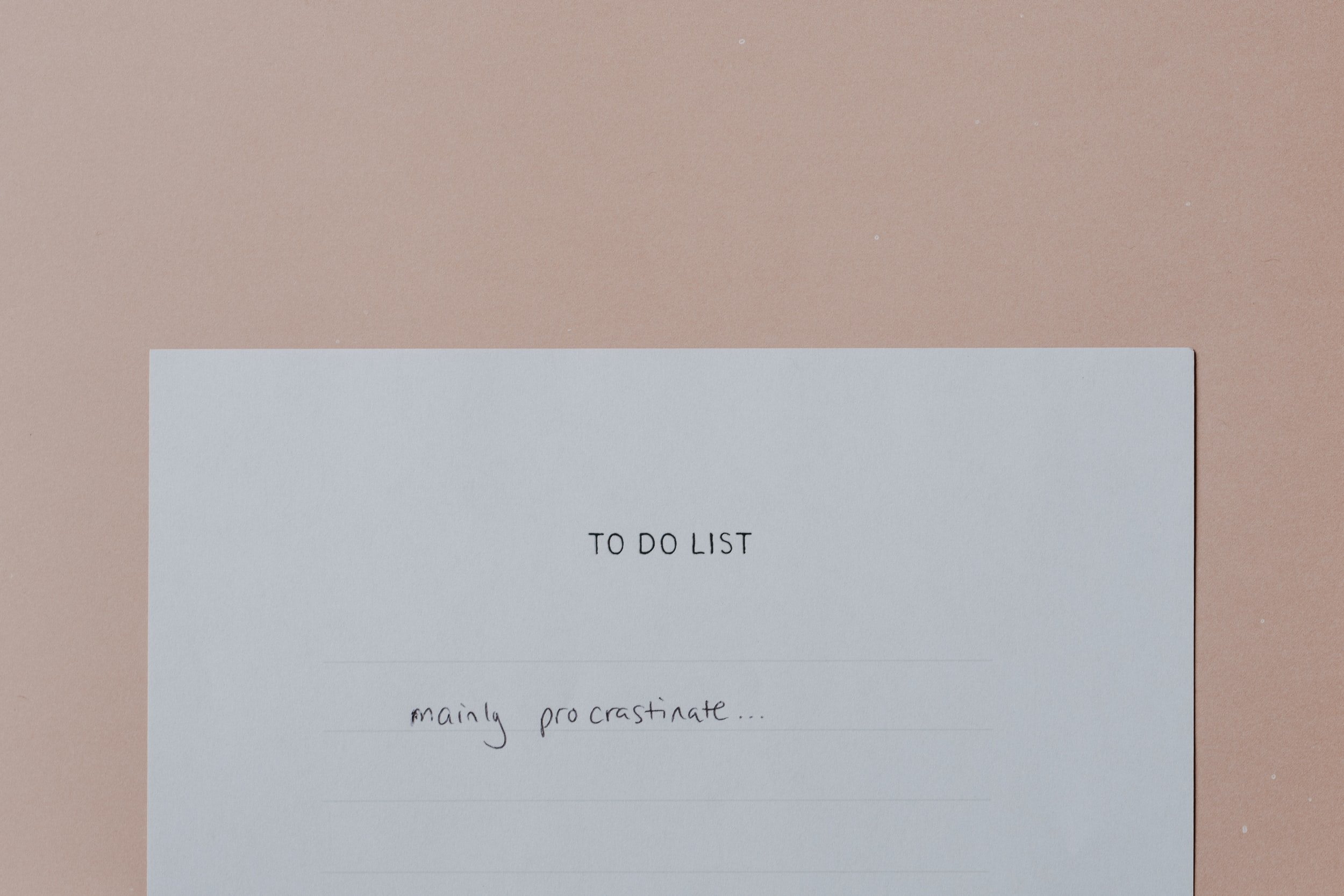 "To do List" written on top of a piece of paper. Below it written "mainly procrastinate".