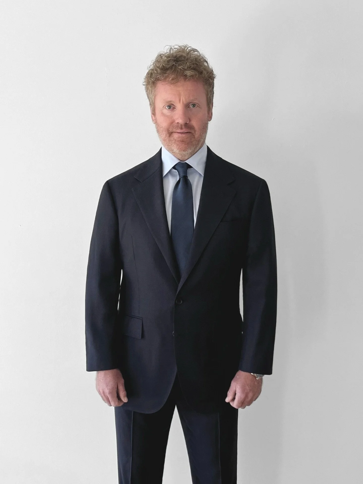 Client portrayed, where made-to-measure craftsmanship takes focus.