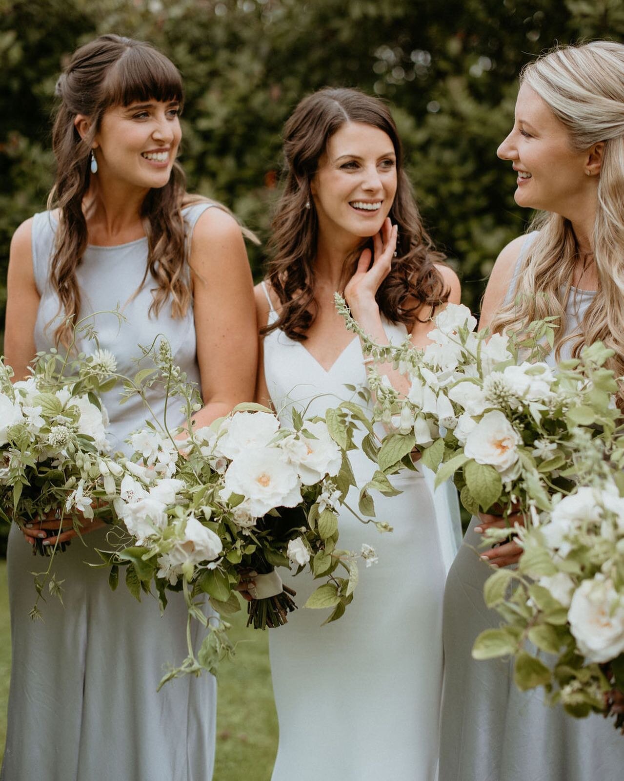 Stunning Becca and her girls with their late summer bouquets of roses, foxgloves, philadelphus and jasmine tendrils. Captured so perfectly by @clairefleck, with Becca wearing @suzanneneville 🤍