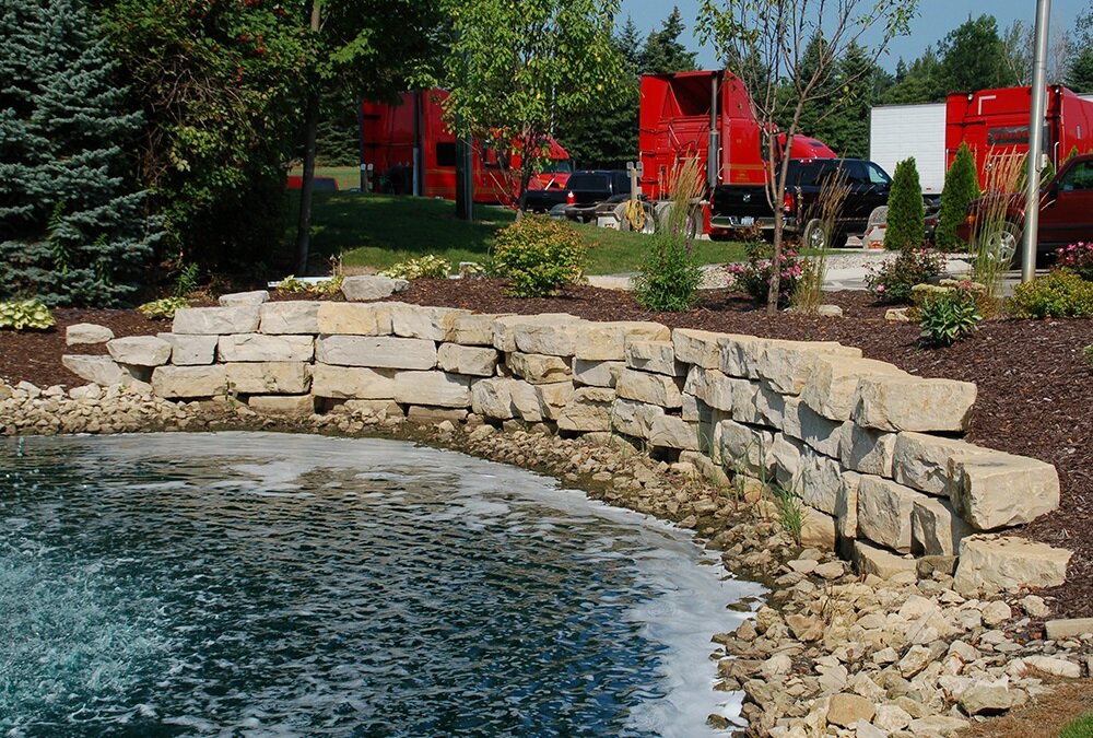 Landscape design with water feature and natural stone in Zeeland, MI