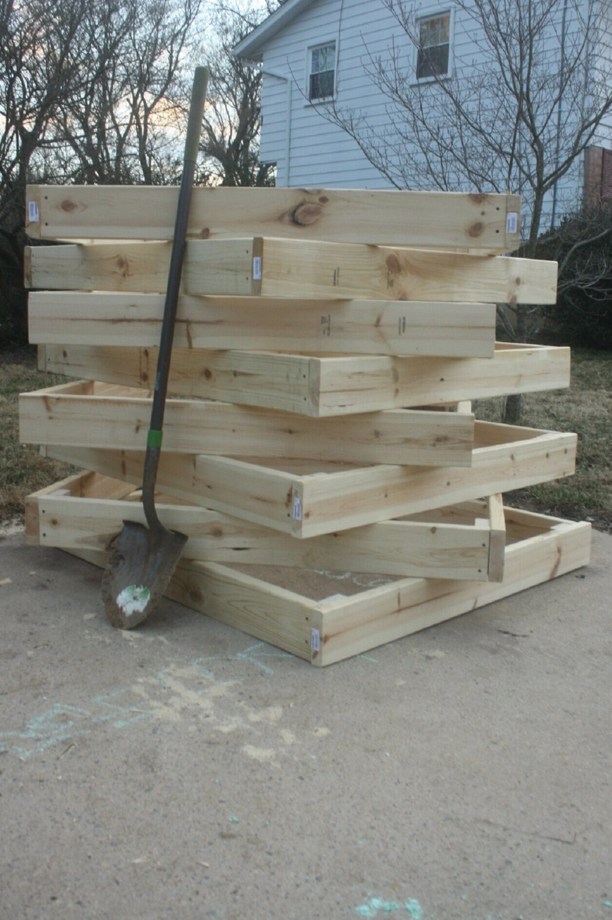 8 4feet by 4feet boxes ready to install at a community garden.  I built them at home and then packed them into the minivan and elementary-aged kids carried them to the garden plot.