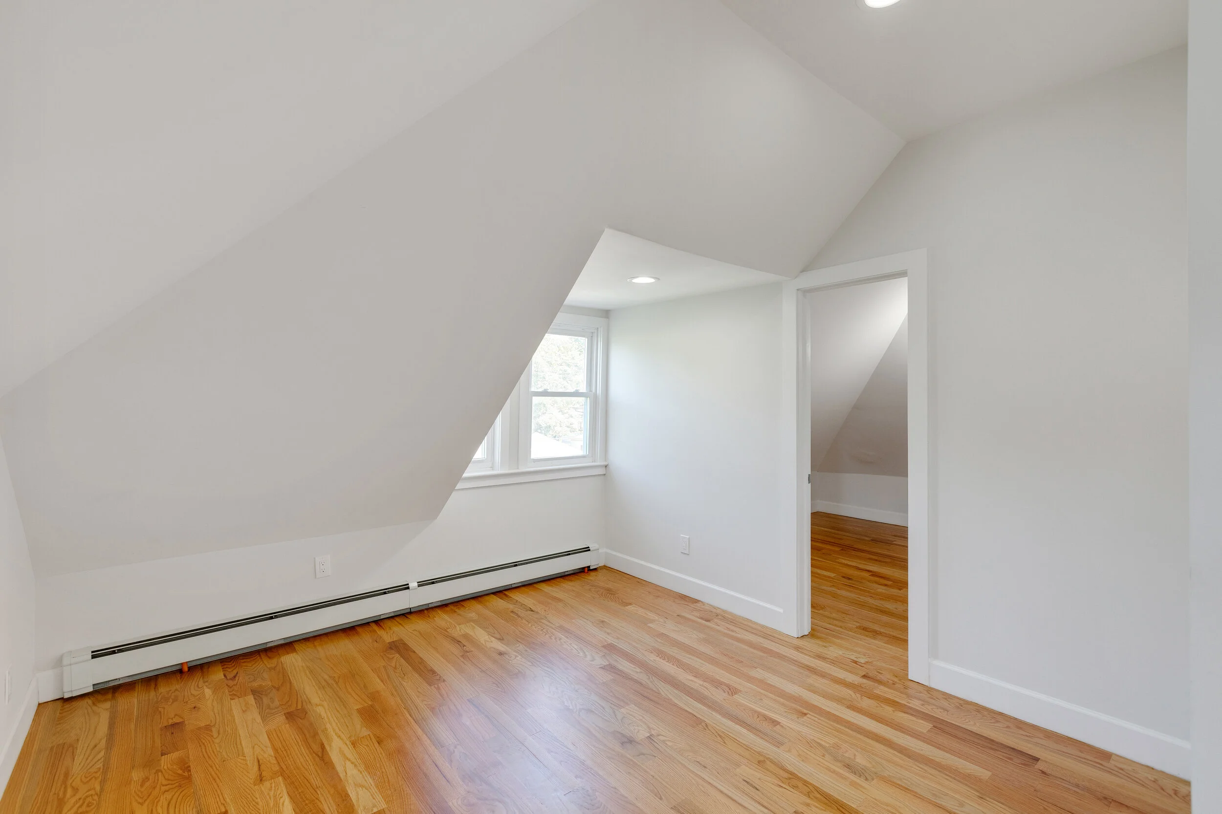 This bright, lovely, brand new 1 bedroom on the 3rd floor of fully renovated 3-unit home