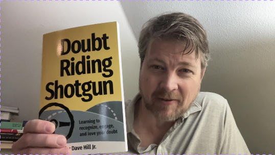 Author-Dave-Hill-Jr.-holding-Doubt-Riding-Shotgun.png