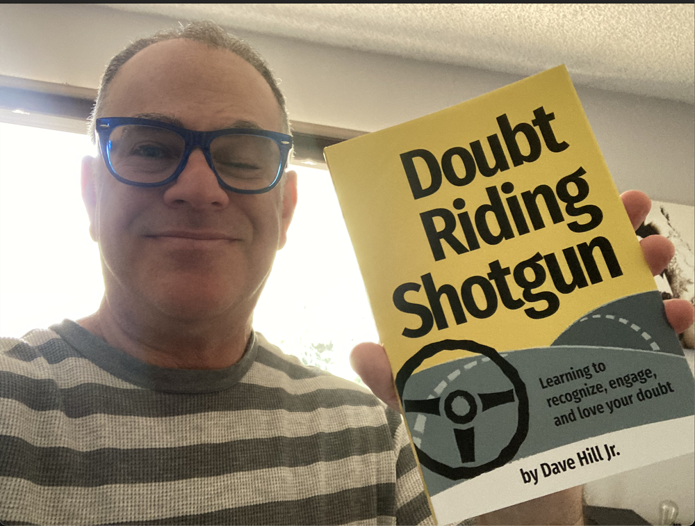 Author-Jeff-Leisawitz-holding-book-Doubt-Riding-Shotgun.png