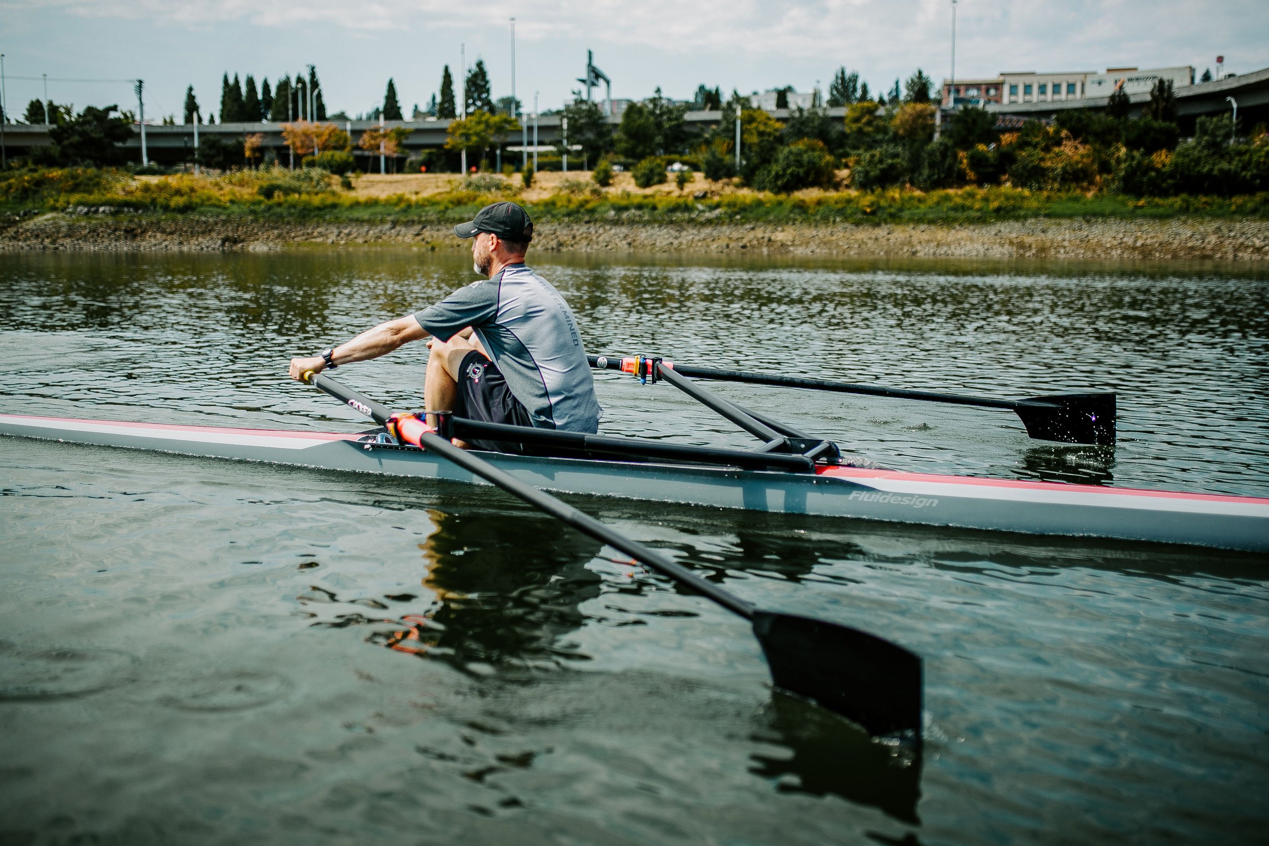  Dave Harvey, founder of Tacoma Rowing, and partner in the Know You Can Row campaign, rows his 1x on the Foss Waterway in the shadow of Mount Tahoma, and on the homelands of the Puyallup Tribe and the Coastal Salish tribes. 
