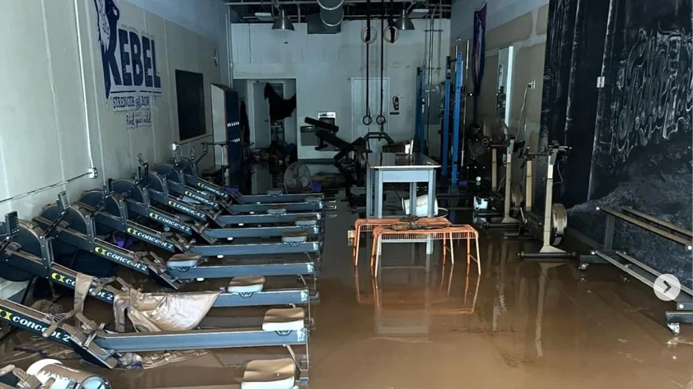 Rebel Strength and Rowing, located in the River Arts District of Asheville, NC, was completely destroyed in flooding caused by Hurricane Helene. Owner Adam Smith is determined to reopen. 