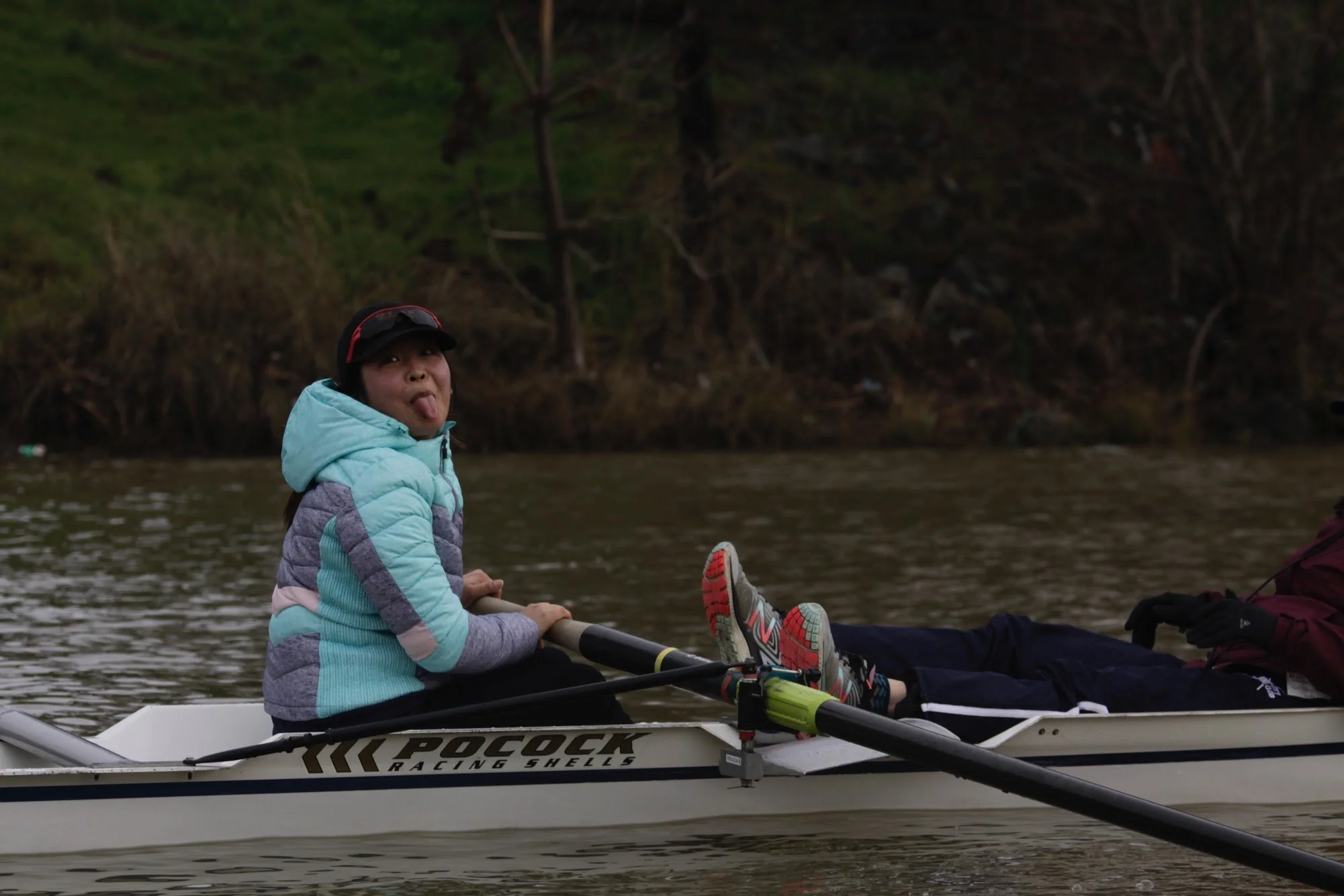 Lea stroking an 8 - Coxswain's Log.JPG