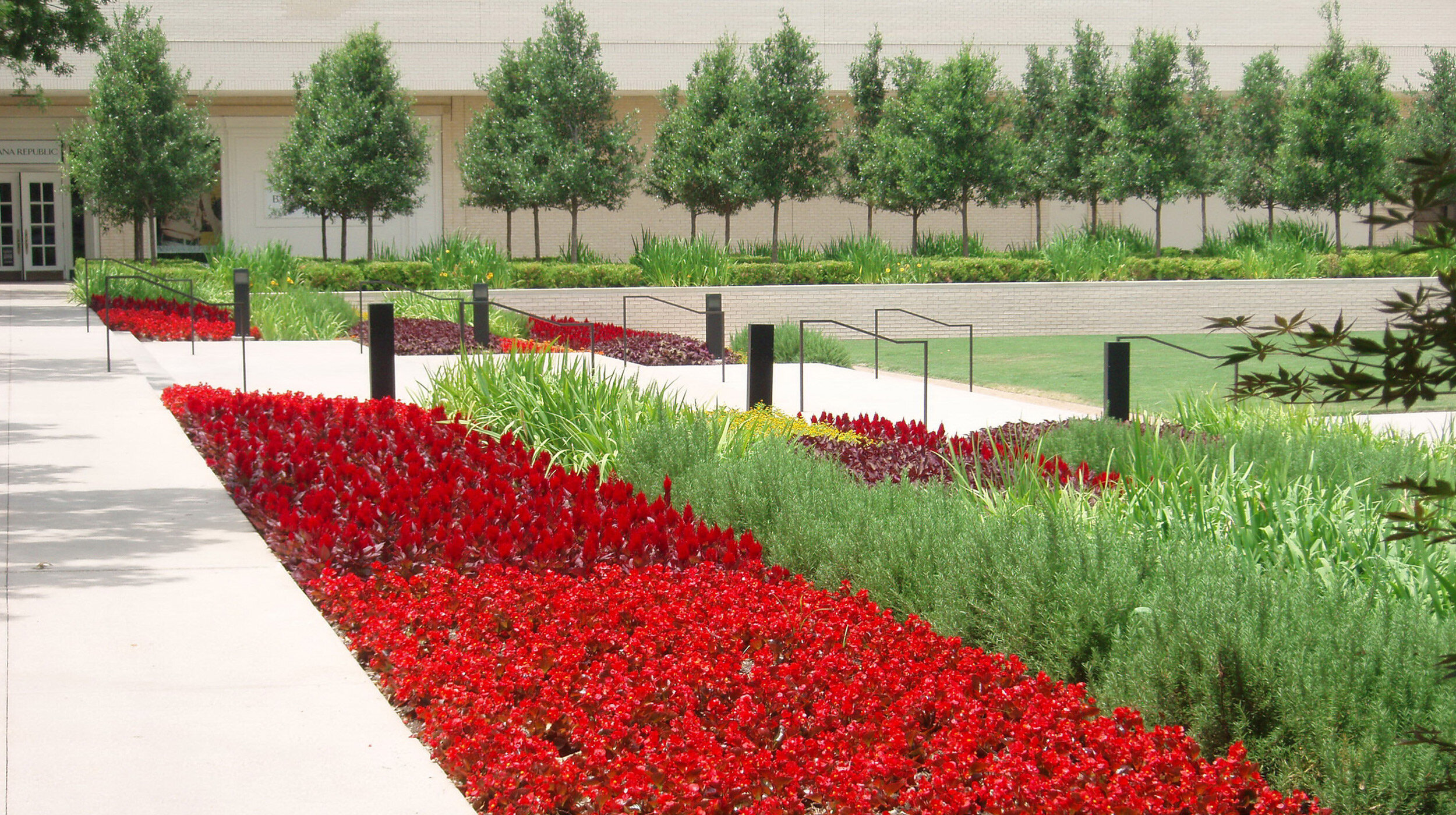 CenterPark at NorthPark Center (Dallas TX). Terraced flower beds outside of  Louis Vuitton.