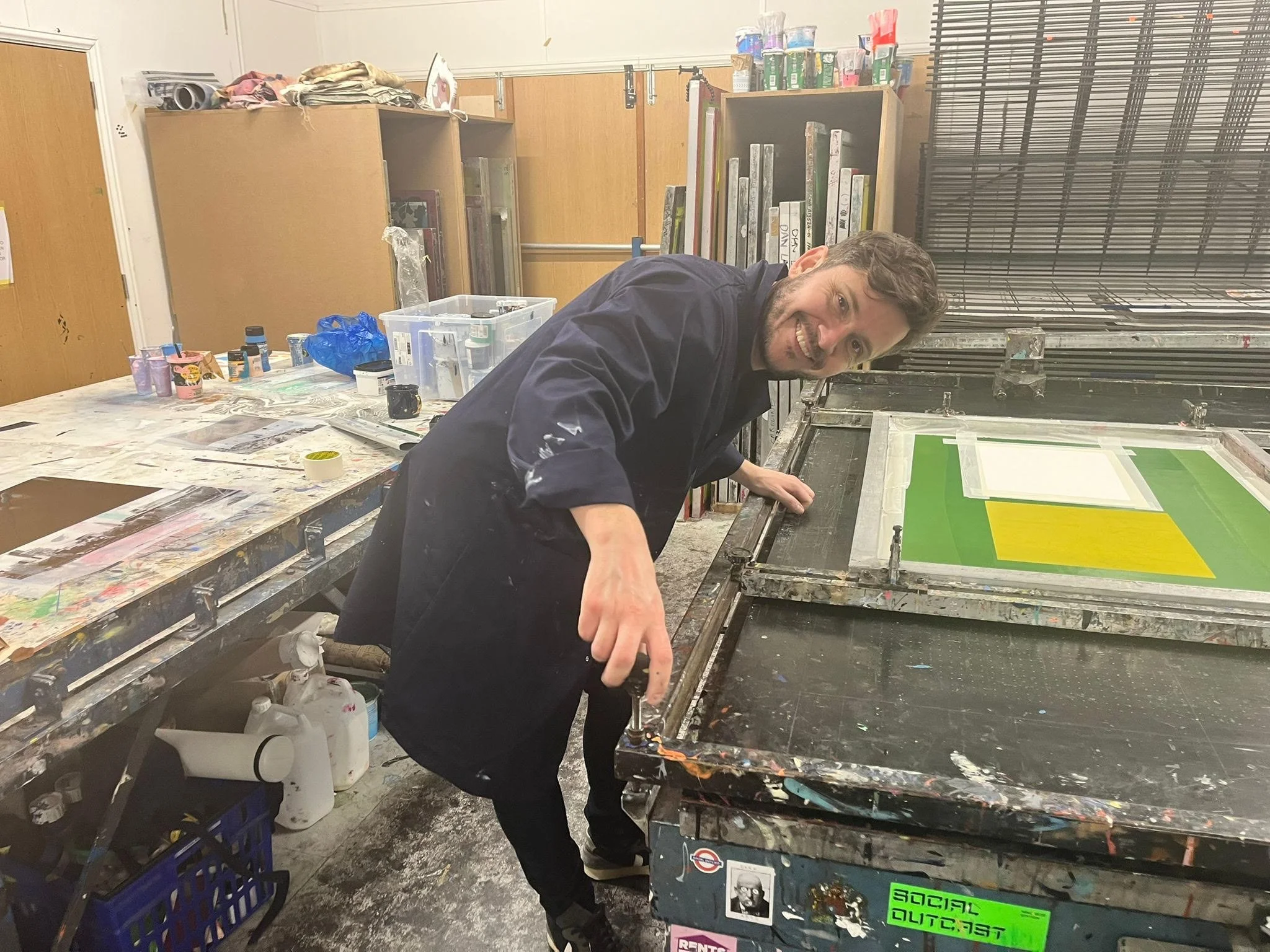 Pulling the first layer of colour — each print goes through several carefully registered layers.