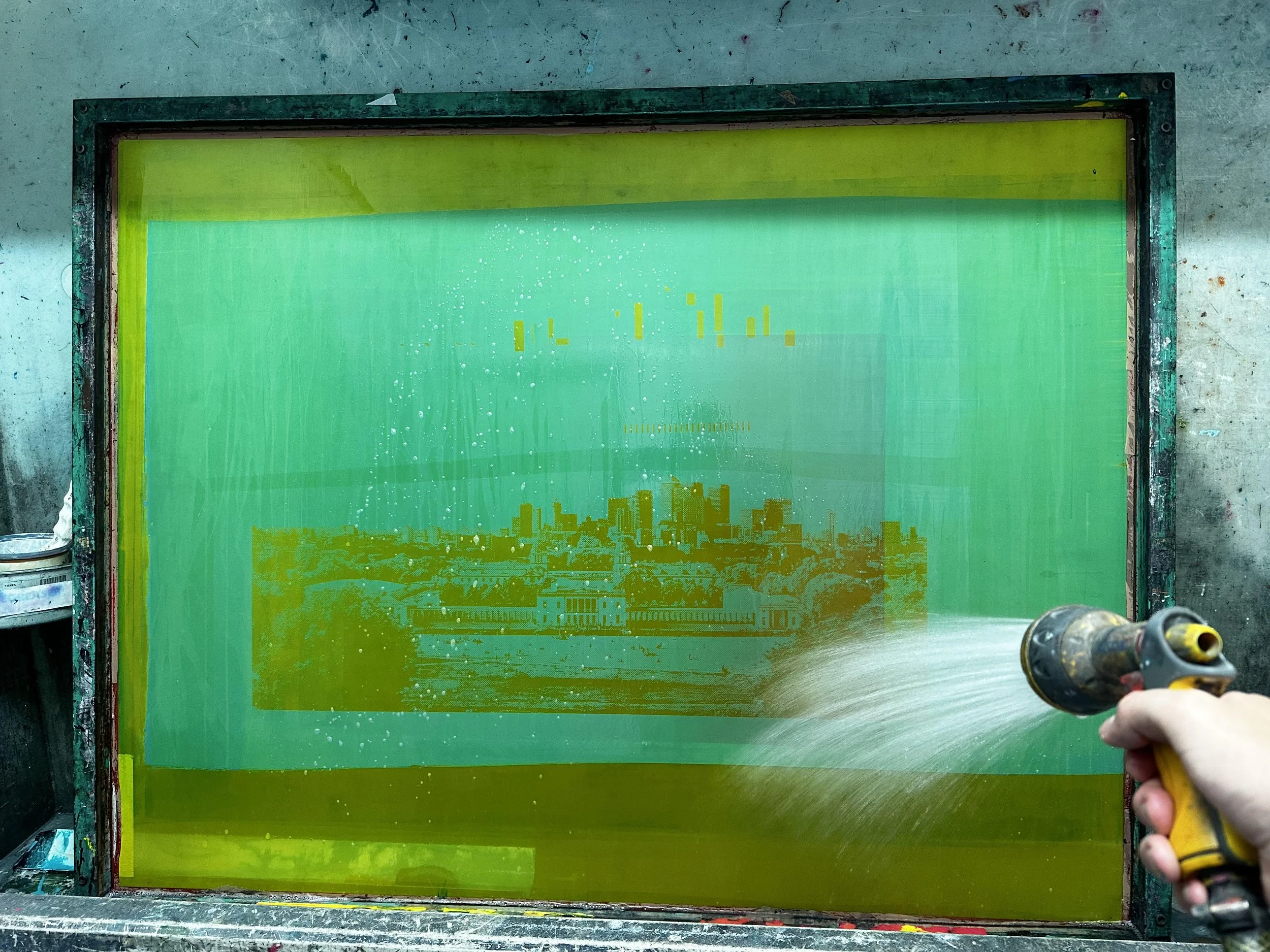 Washing out a screen ready for printing, where the magic happens!