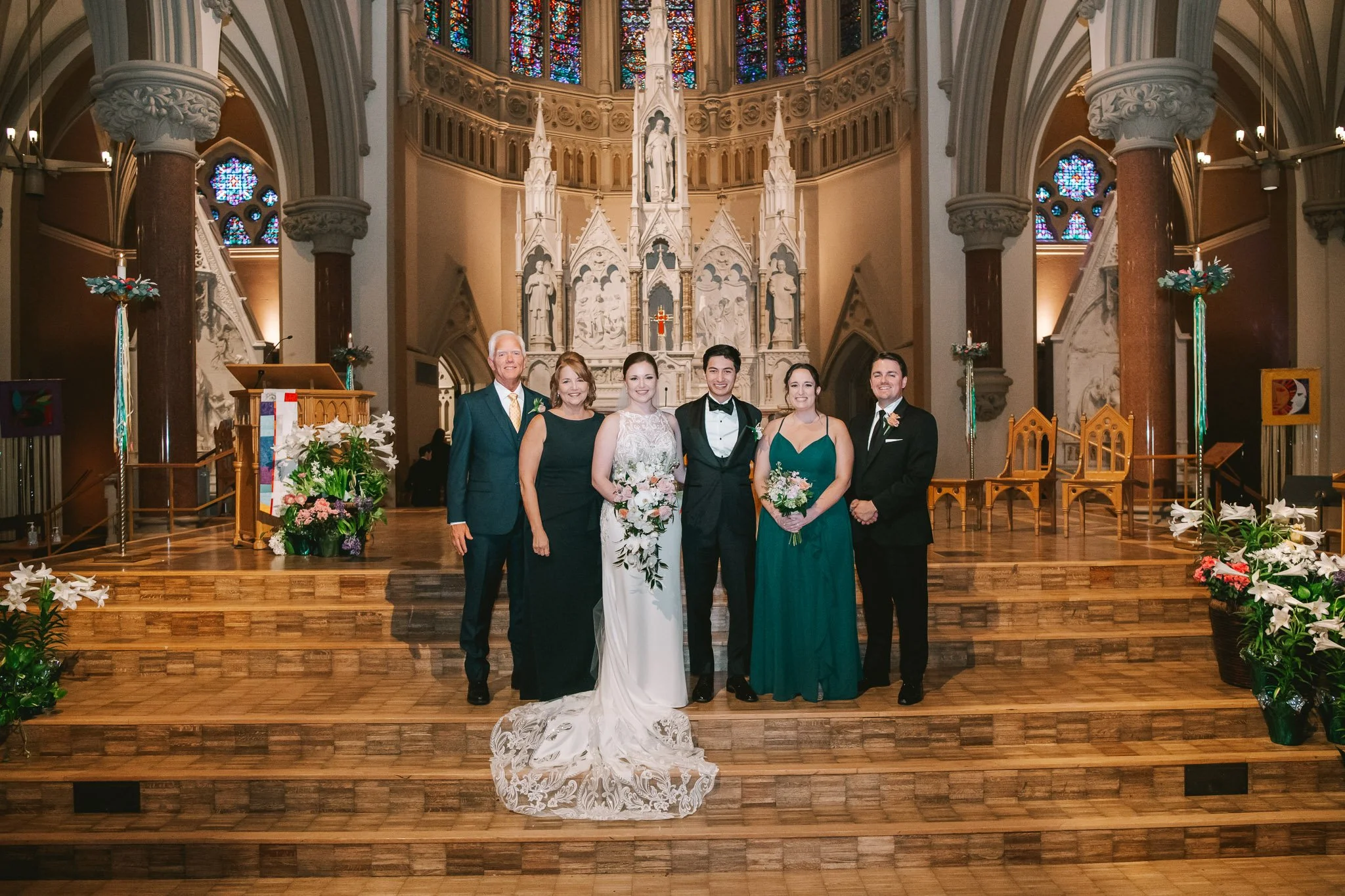 formal family portrait at St. Xavier College Church in Saint Louis, Missouri photographed by Jewels Photo Co.
