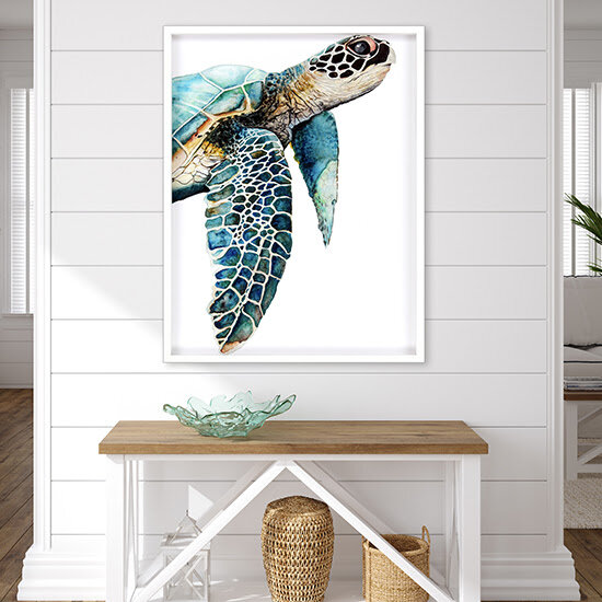Home décor: The Great Sea Turtle by Paragon &nbsp;giclee, artwork by Jodi Hatfield, depicts an incredibly colorful turtle gliding effortlessly on his journey. Measuring 50” high x 3” wide x 3” deep, the vertically oriented image is framed in a lacquered white wood shadow-box-style molding. (IHFC - C203, Commerce, Floor 2)