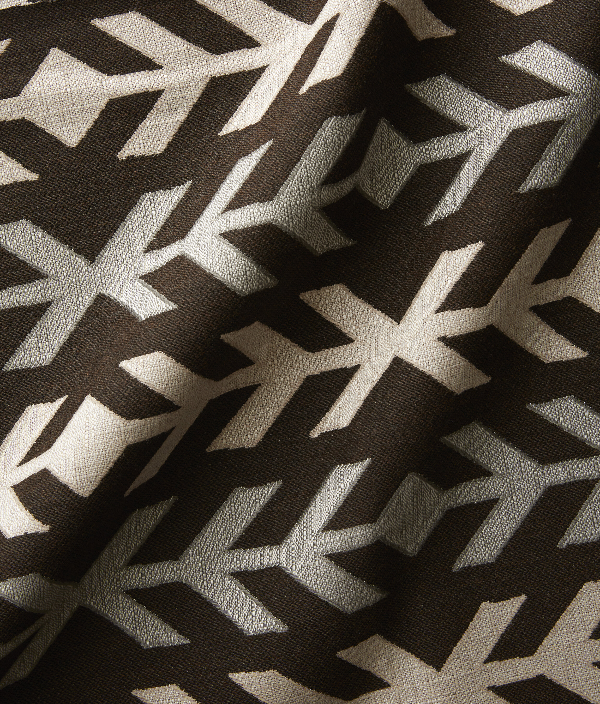 Sunbrella’s Addie II Espresso takes a subdued approach to pattern with shades of brown, gray and cream.