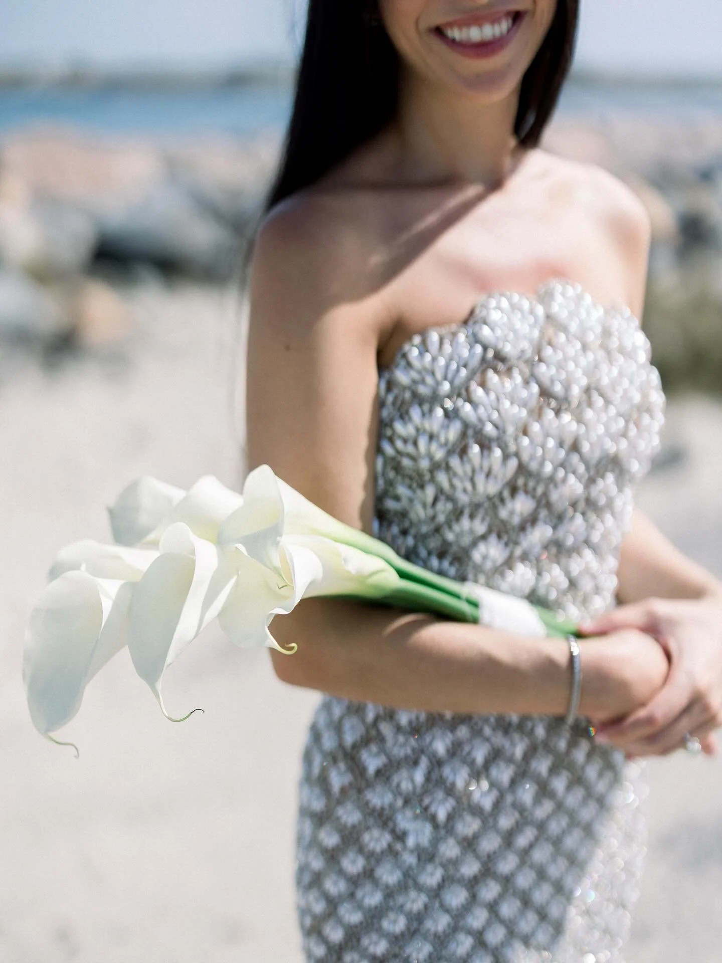 Can&rsquo;t decide what I love more&hellip; Jess&rsquo;s classic calla bouquet or her gorgeous dress ✨ Even more stunning in person! Perfect for her Italy elopement, and she looked like a bridal mermaid on the Hamptons beach. Such a beautiful day cap