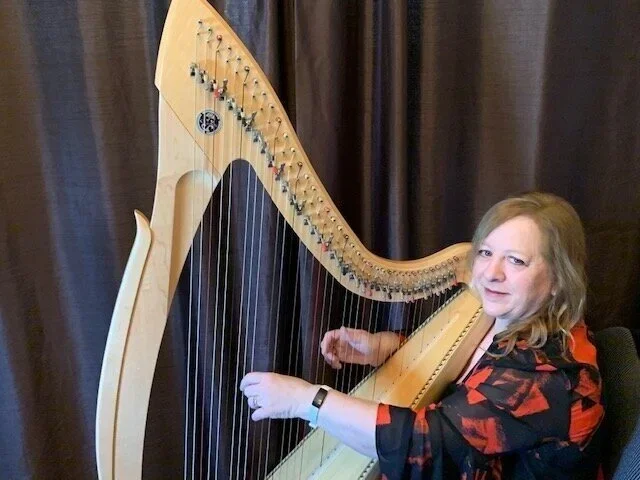 harp therapist playing harp