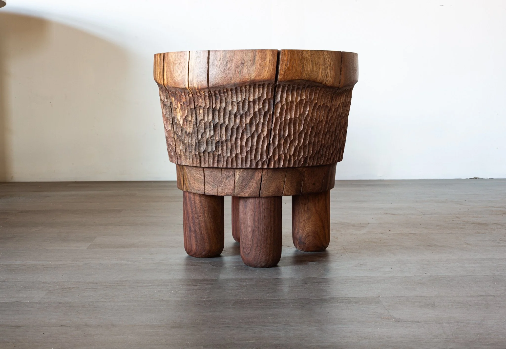Black walnut side table with textured side and four legs