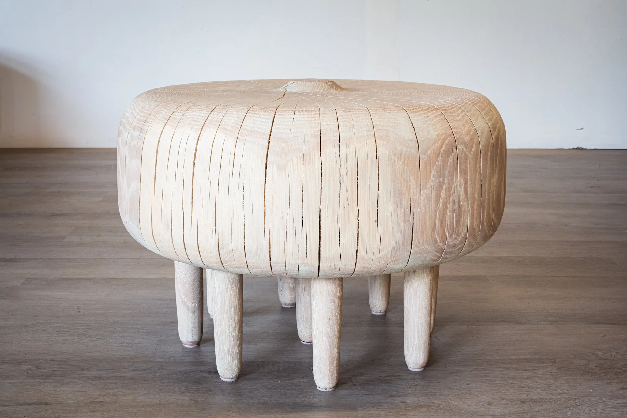 Bleached white oak side table with many legs