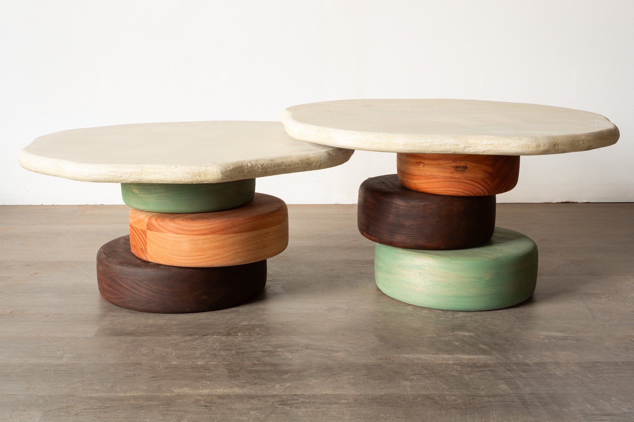 Stained eucalyptus and micro cement nesting tables