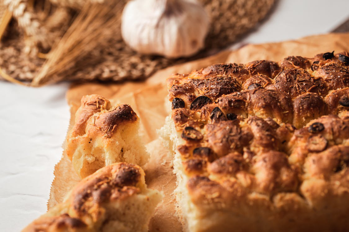 A close up of a flat bread laid out on a platform. 