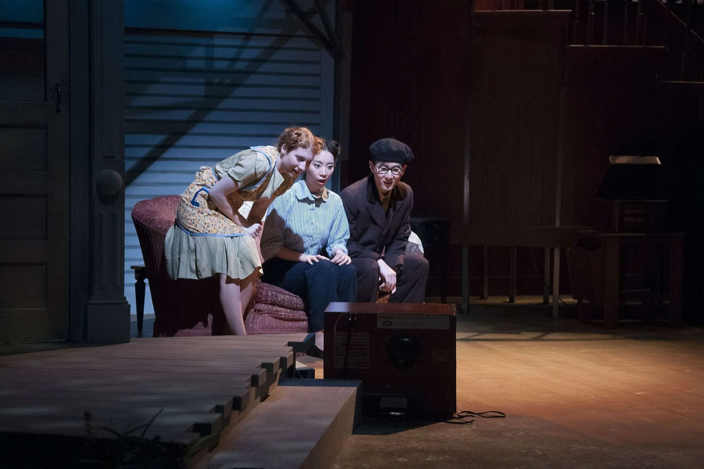 Olga (Schuyler Girion, left), Lillian (Sarang Cho) and Mr. Oji (Tony Jin) see their first TV in Philip Kan Gotanda's "After the War Blues" at UC Berkeley's Zellerbach Playhouse – Courtesy of Ryan Montgomery / SF GATE