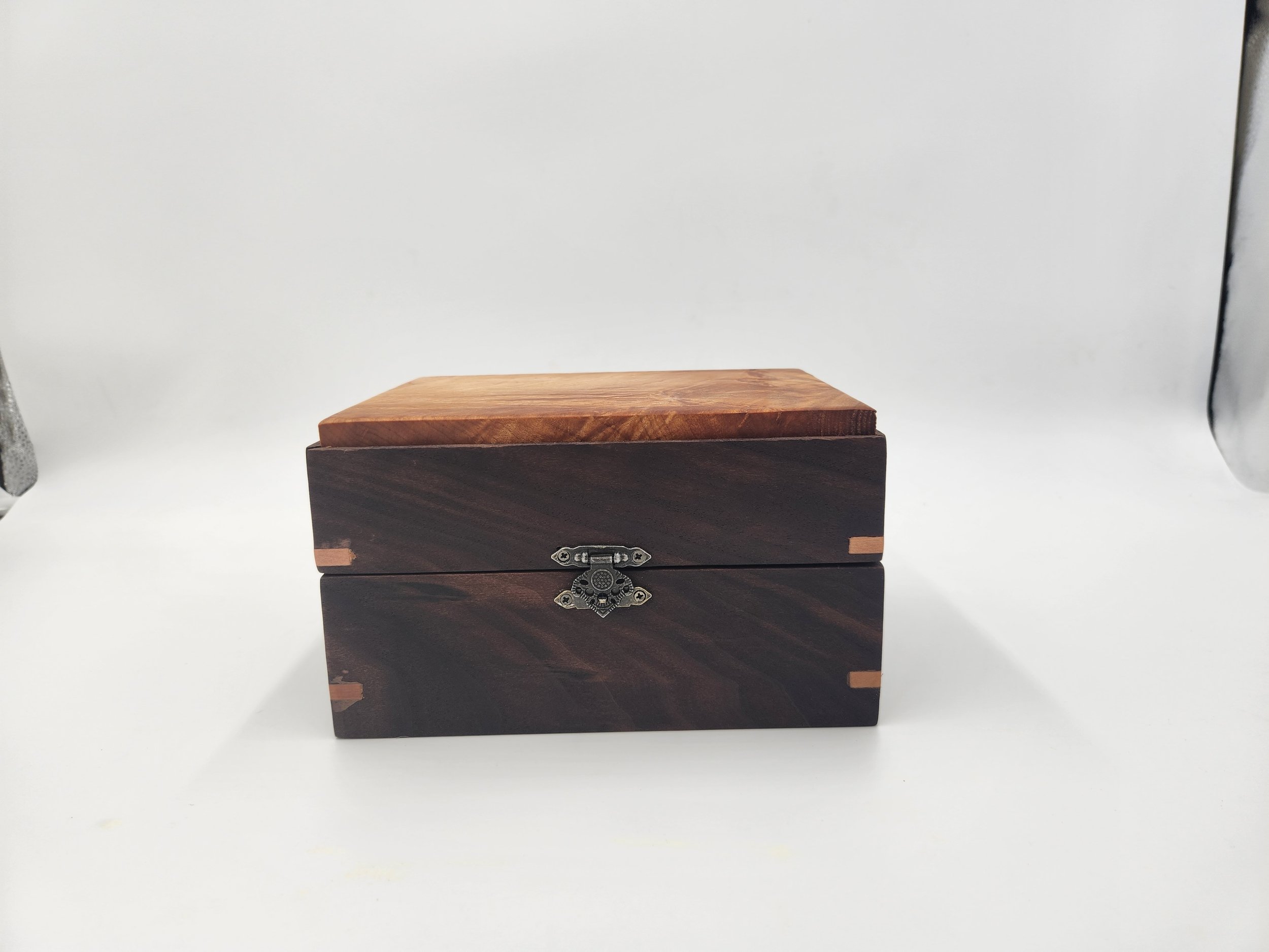 Decorative mitered box with brass latch and hinges, Walnut, with a Big Leaf Maple inset lid.