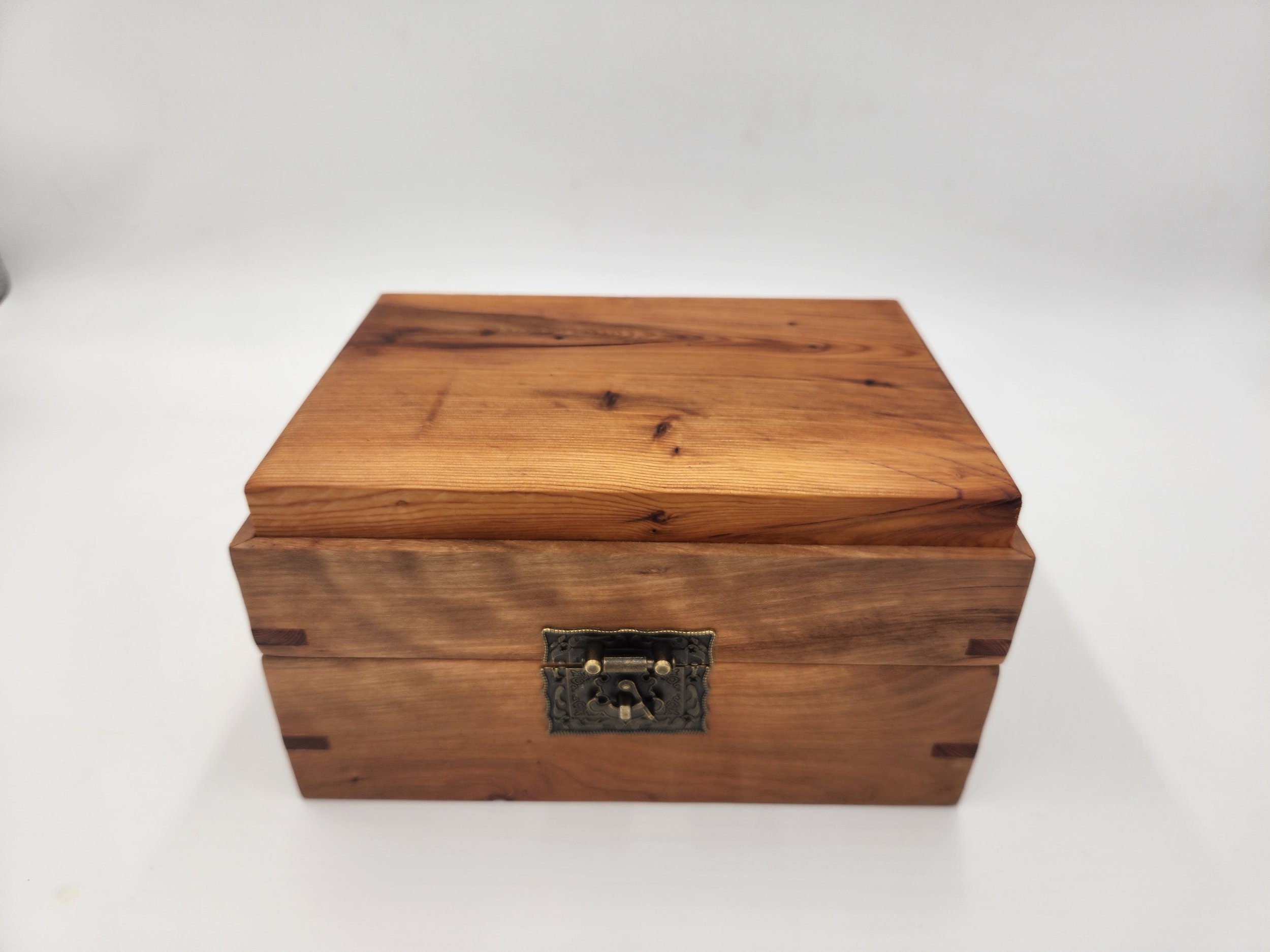Decorative mitered box with brass latch and hinges, in Big Leaf Maple, with a Pacific Yew inset lid.
