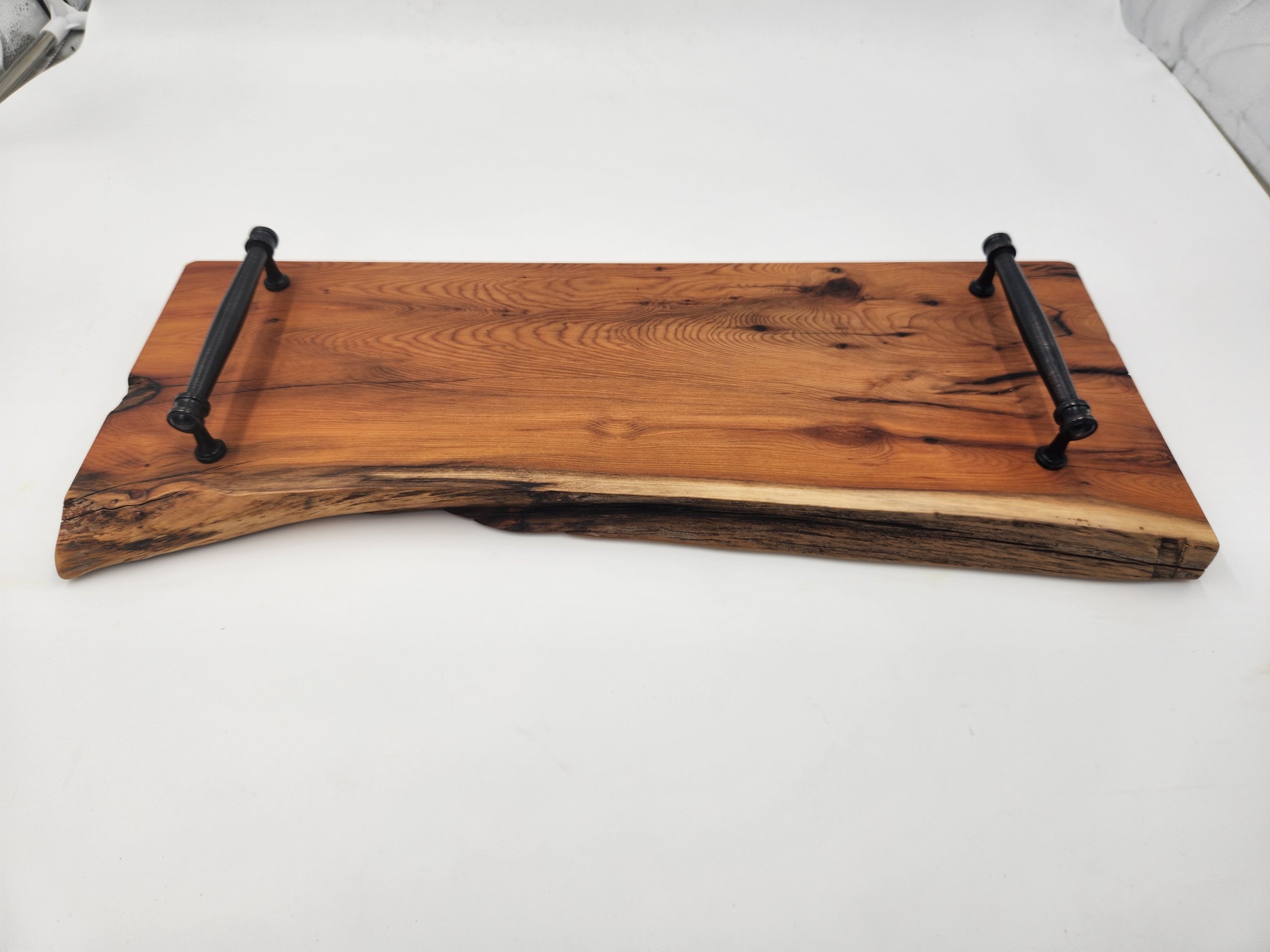 Live edge serving tray in Pacific Yew, with metal handles.