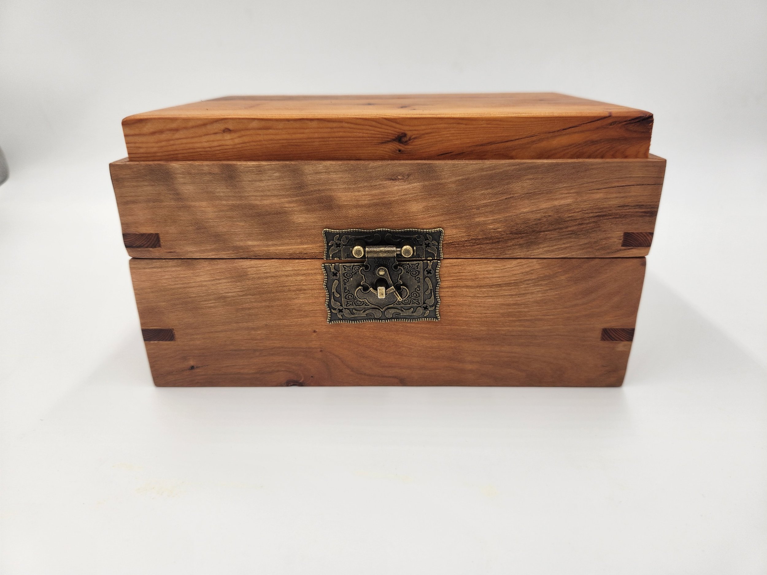 Decorative mitered box with brass latch and hinges, in Big Leaf Maple, with a Pacific Yew inset lid.
