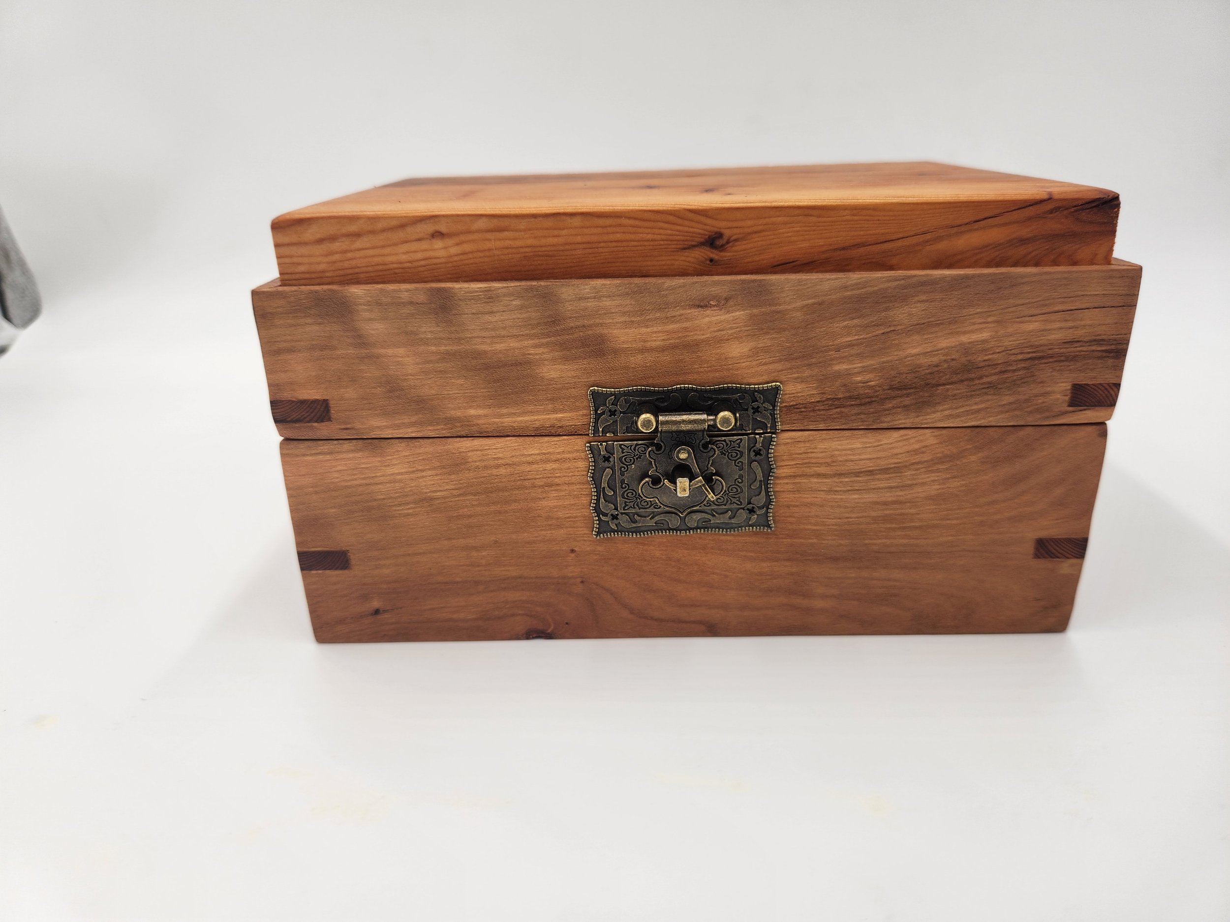 Decorative mitered box with brass latch and hinges, in Big Leaf Maple, with a Pacific Yew inset lid.