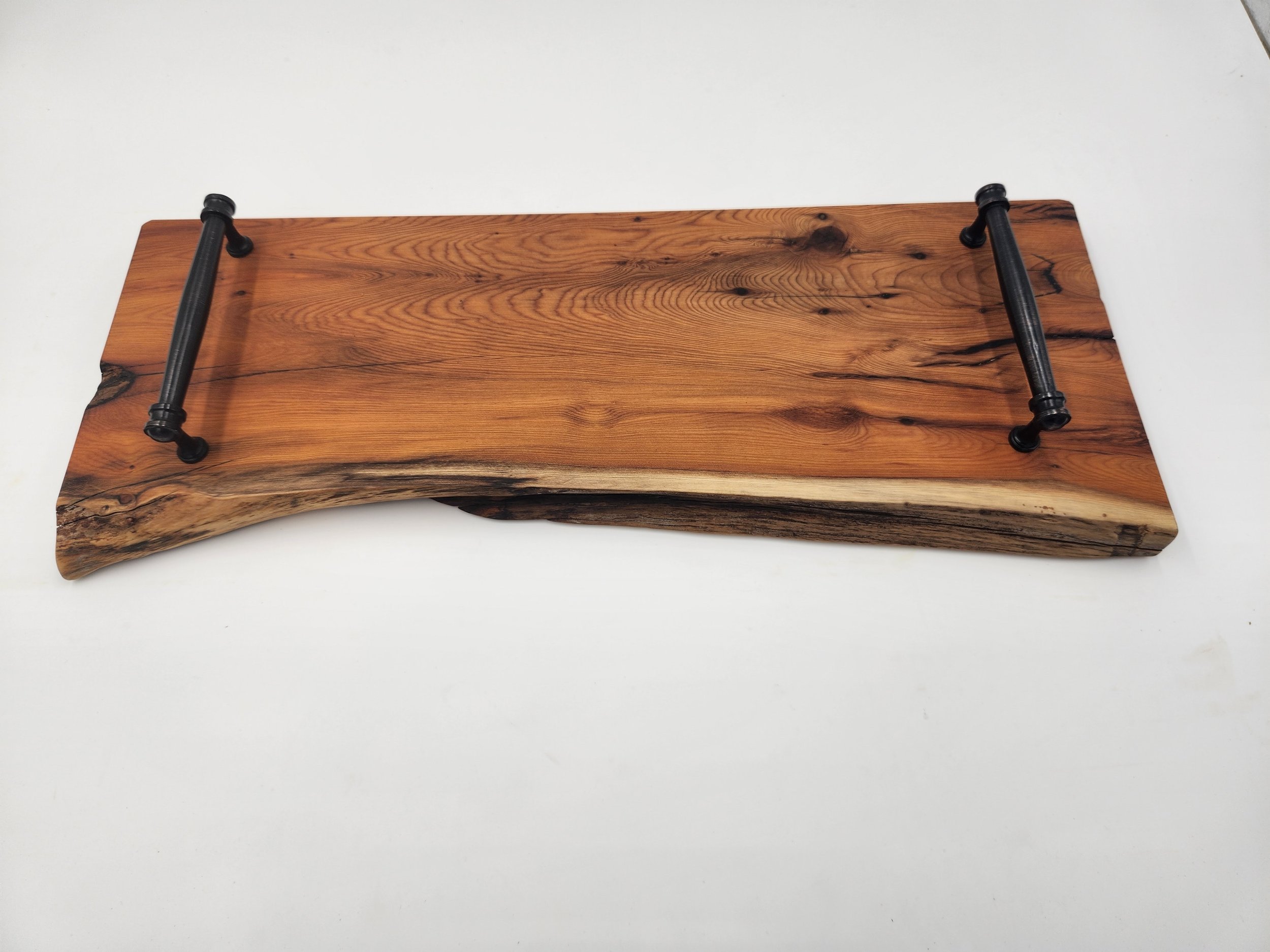 Live edge serving tray in Pacific Yew, with metal handles.