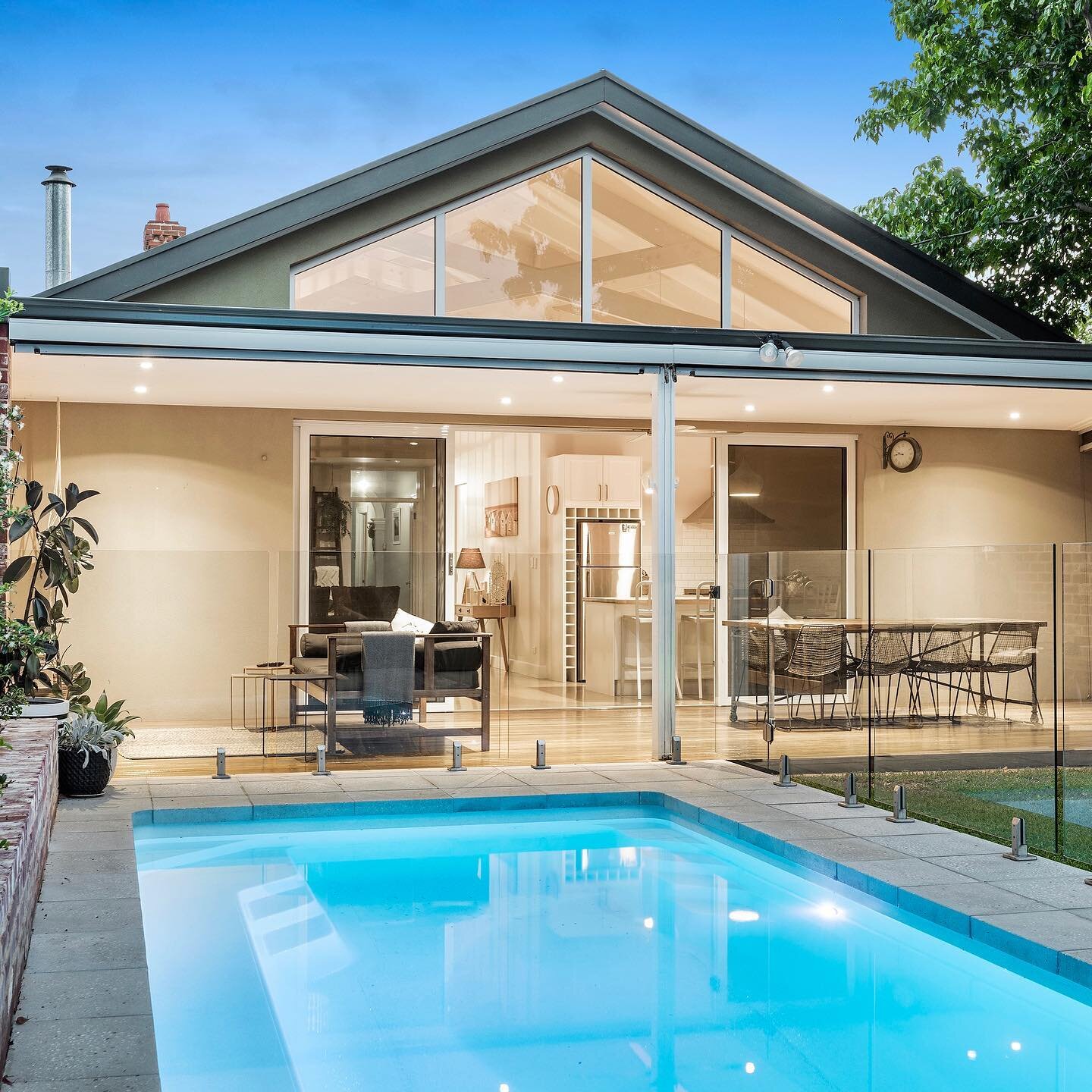 Our Lightly honed Industry grey Drop face pool coping and large format paving looking magnificent around this fibreglass pool. #expossedaggregate #honed #concrete #hewnstone #swimmingpool #pavingadelaide #localbusiness