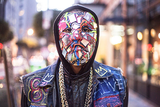  Inspired by pop art culture, this man paints on the streets in Los Angeles, wearing only a mask that he made out of paper mâché.  