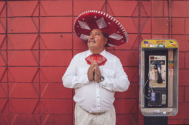   I was strolling along Chinatown, when I noticed this man dressed in traditional mariachi attire. I approached him and asked where he was coming from. He said that he was a singer at church, I was surprised because I assumed it would’ve been some ki