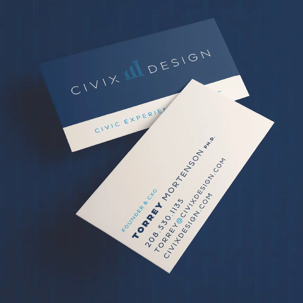 Business card for Torrerey Mortenson Ph.D., founder and CEO of CIVIX DESIGN, with contact information including phone number, email, and website, placed on a blue surface alongside a matching design box for CIVIX DESIGN.