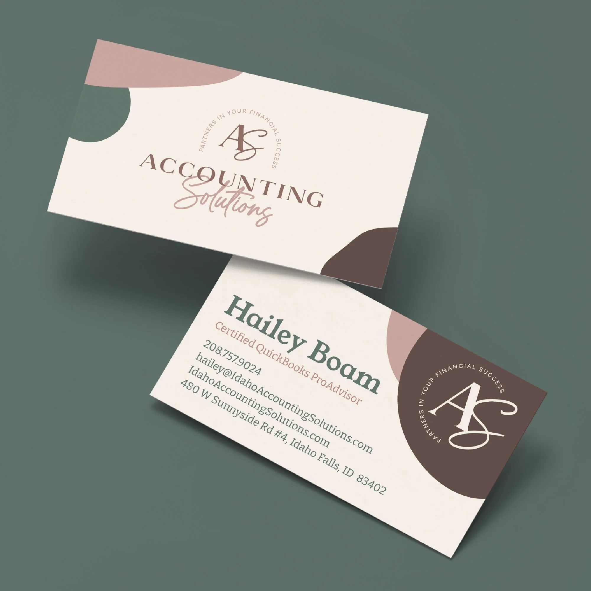Business card for Hailey Baum from Accounting Solutions, with contact information including phone number, email, website, and address, featuring a logo with the initials 'AS' and the tagline 'Partners in your financial success'.