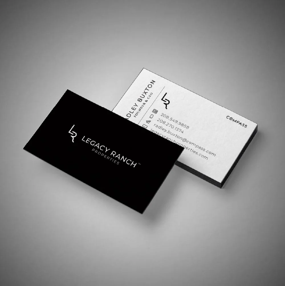 Business cards for Legacy Ranch Properties, featuring the logo and contact information for Doley Buxton.