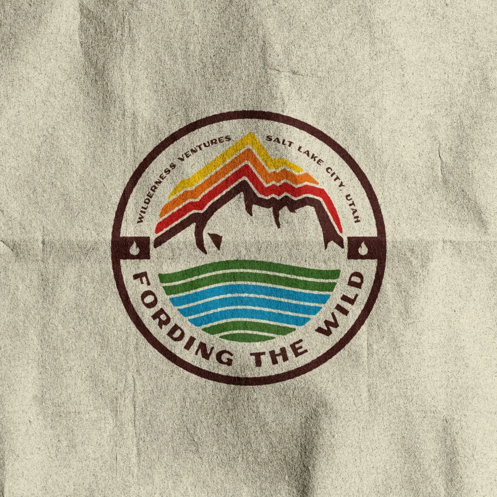 Logo with mountain, water, and rainbow elements, with text 'Wilderness Ventures Salt Lake City, Utah' and slogan 'Fording the Wild'