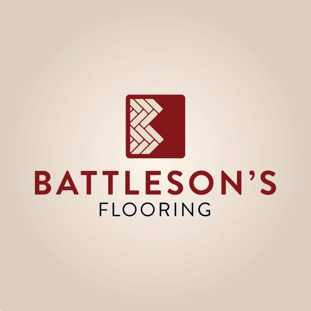 Logo for Battleson's Flooring, a heritage company in Idaho Falls, featuring a stylized brick pattern in a red square above the company's name.