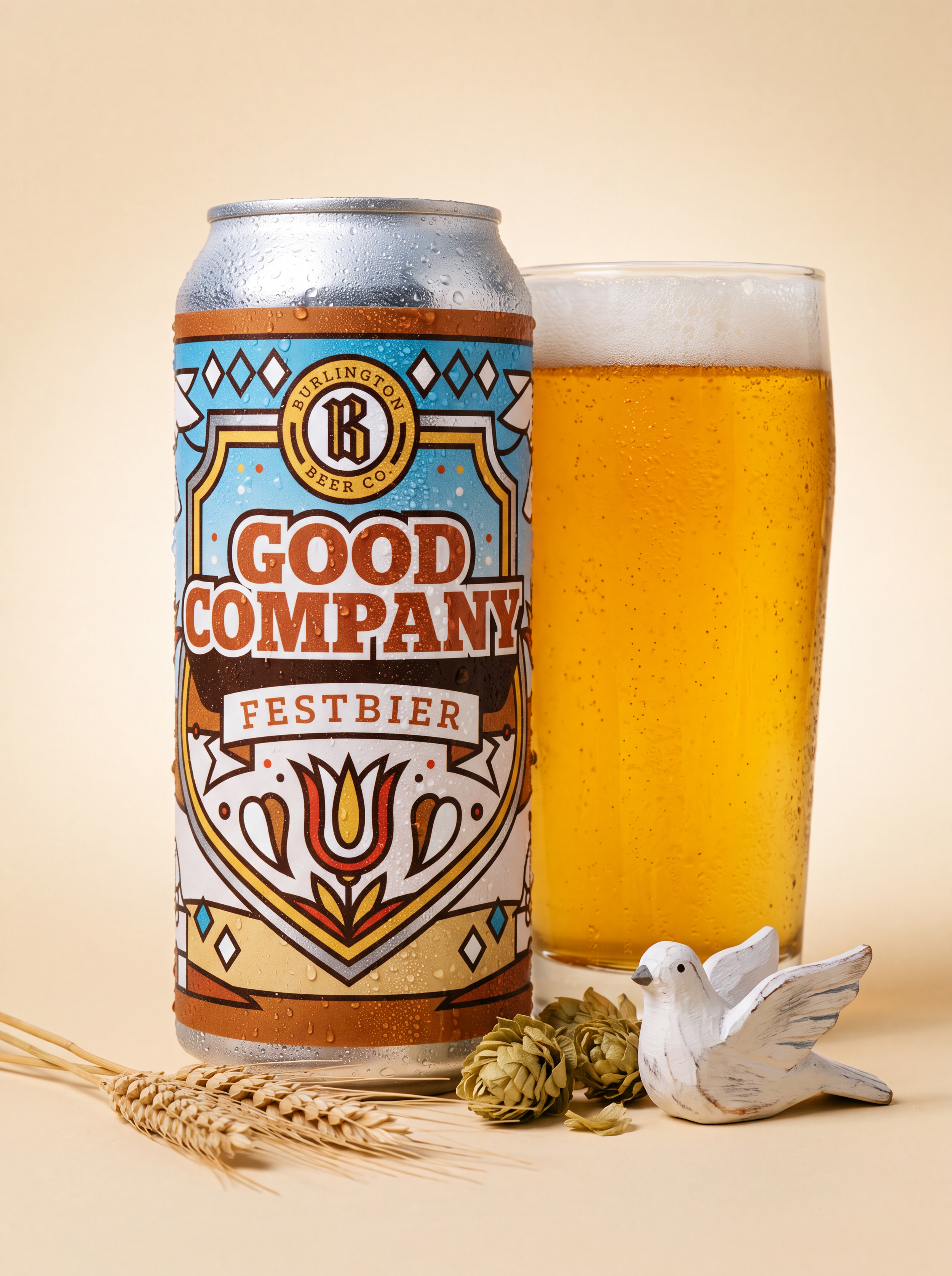 Burlington Beer Co. Good Company Festbier can beside a golden beer pour with foam.